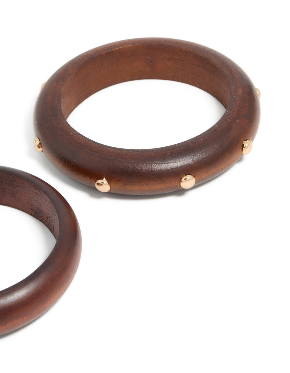 Showcasing studded wooden bangles in a 2-pack with saddlebrown and gold finishes, designed in statement chunky style in close up view