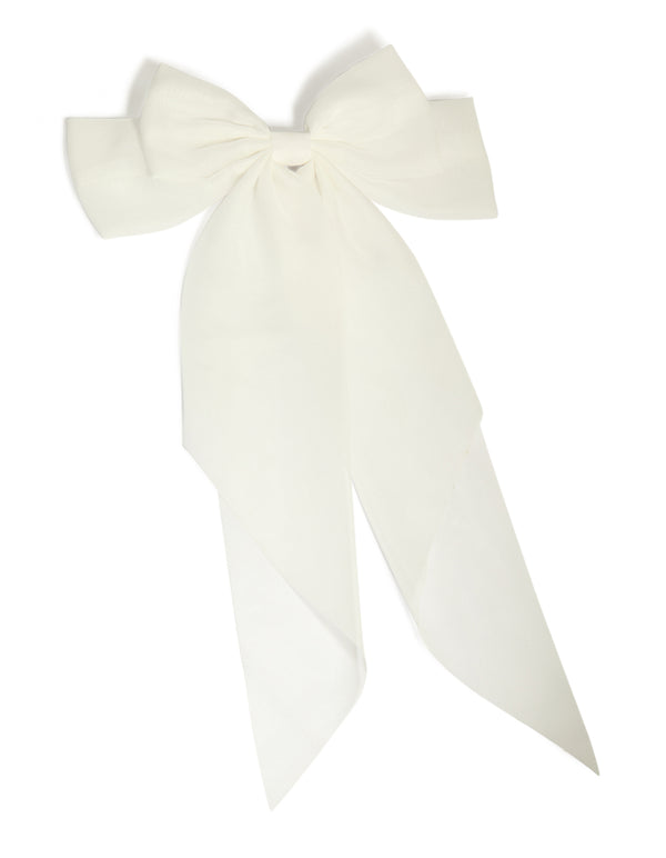 Introducing a white fabric large bow clip with solid print in ivory front view