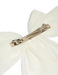 Showcasing a white fabric large bow clip in ivory with solid print detail view - link has visual effect only