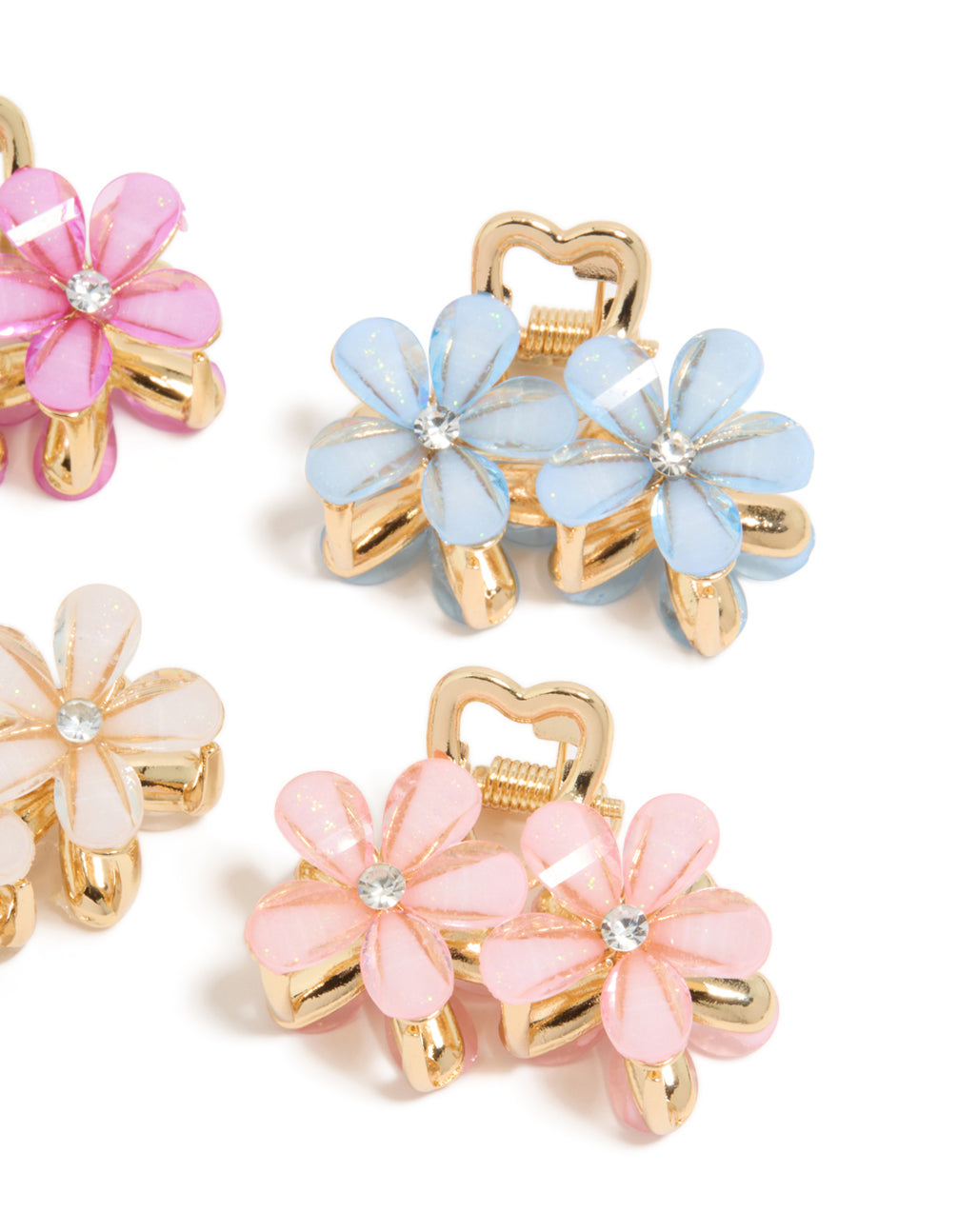 Crafted with gold double flower diamante claw clips in a 4-pack, floral pattern clasp detail view