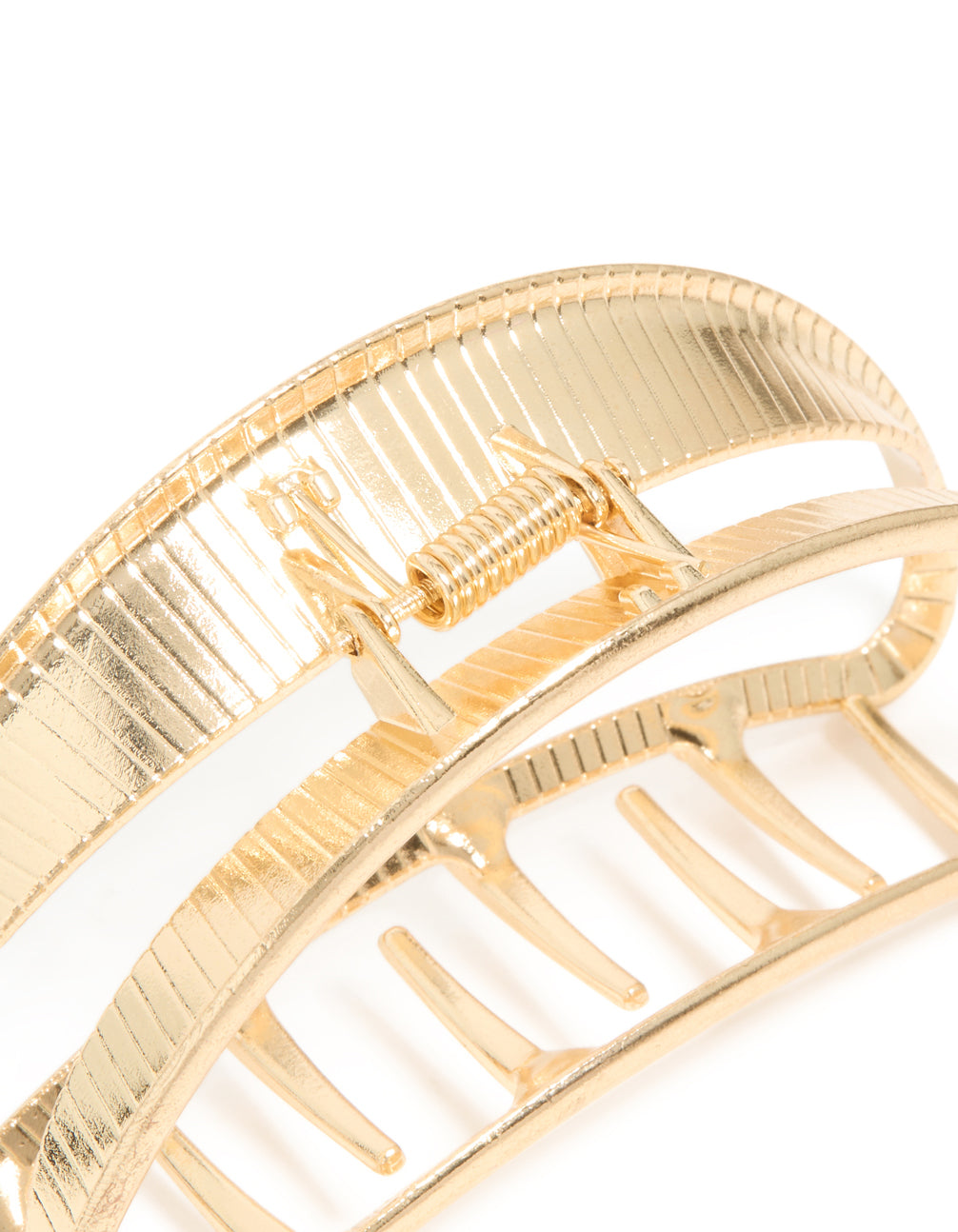 Close-up view of gold half moon claw clip detail view