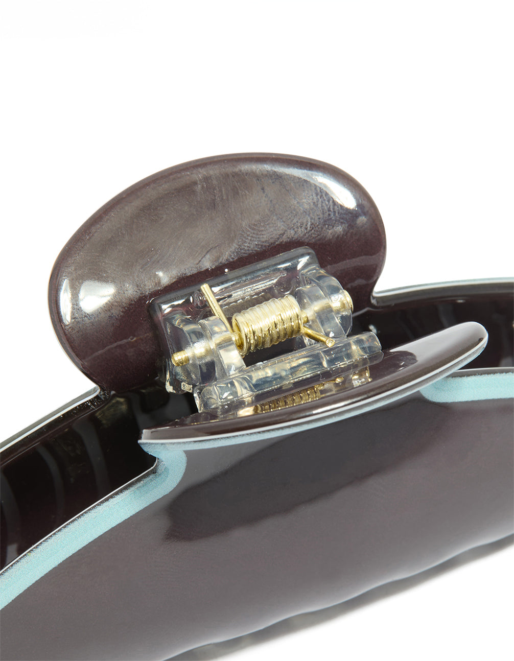 Close-up of chocolate brown acrylic claw clip featuring pale blue outline and silver closure mechanism detail view