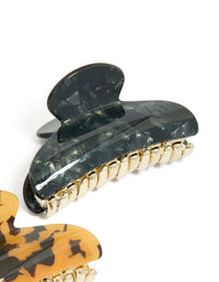 Crafted with tortoiseshell and black acrylic curved claw clips in a 2-pack featuring gold accents side view - link has visual effect only
