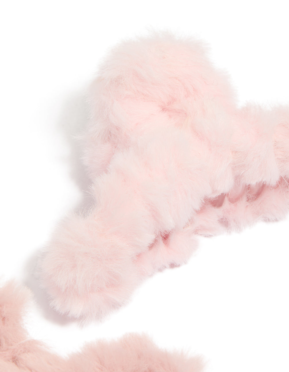Explore pink faux fur fabric small claw clips 2-pack side view