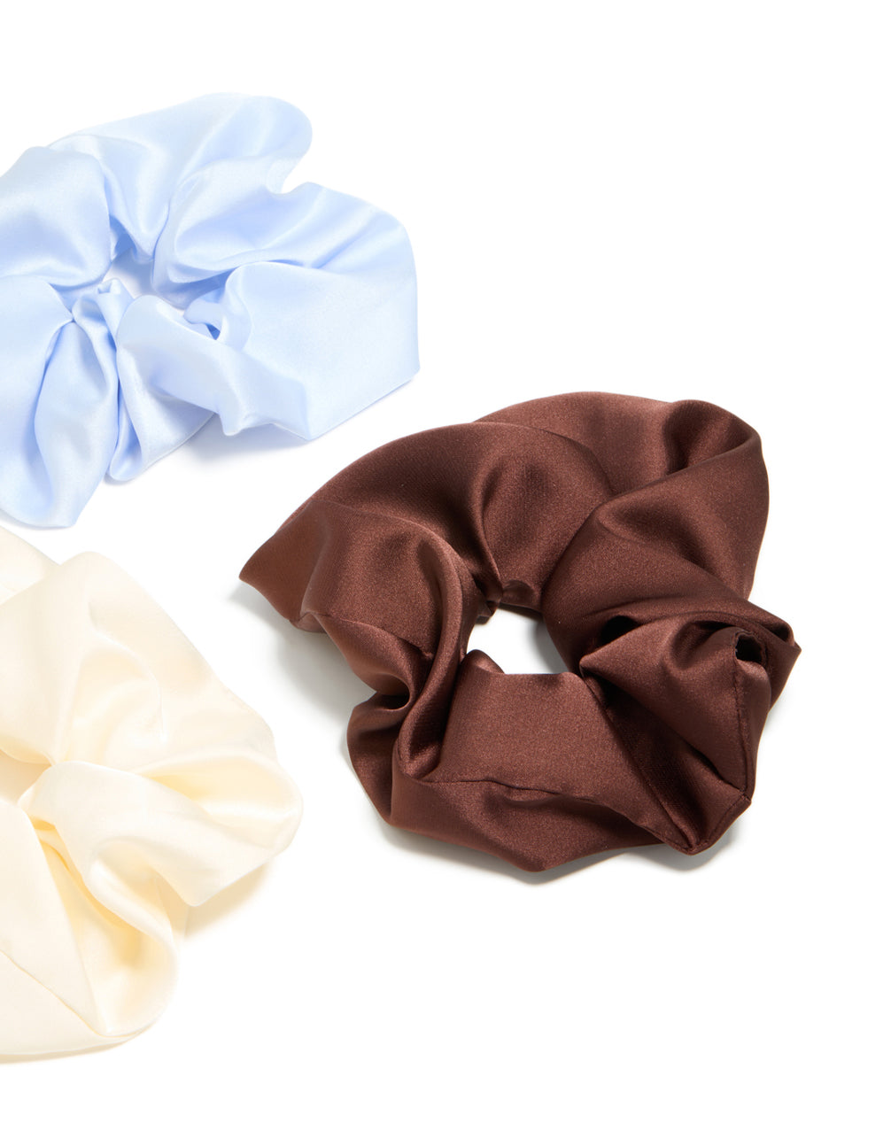 Featuring a brown satin fabric scrunchie from the 3-pack with solid print side view