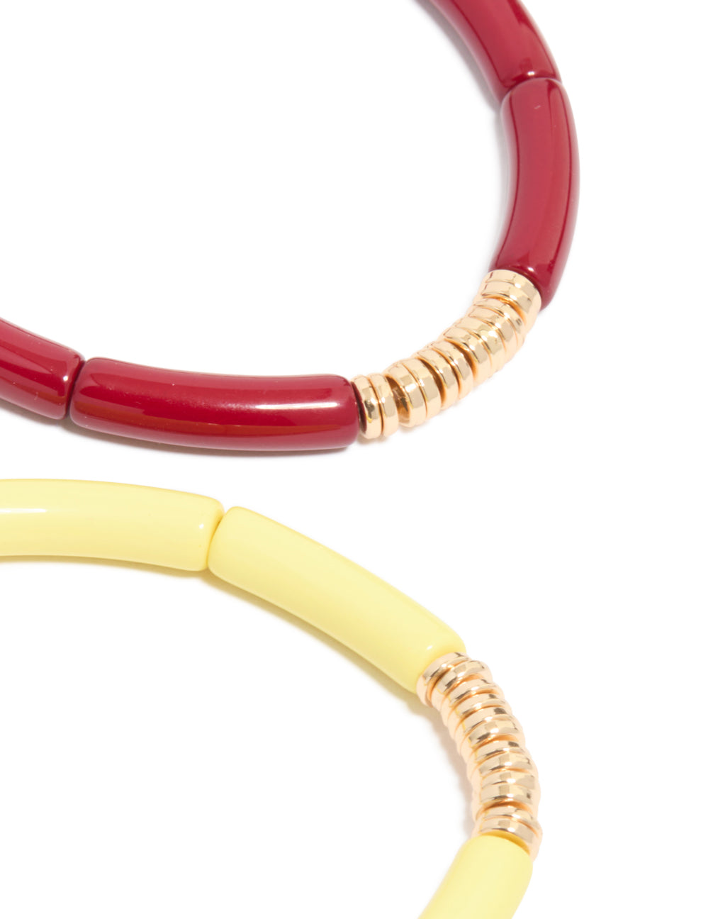 Featuring multicolored acrylic bracelets with beads feature in gold rings 4-pack with close up view