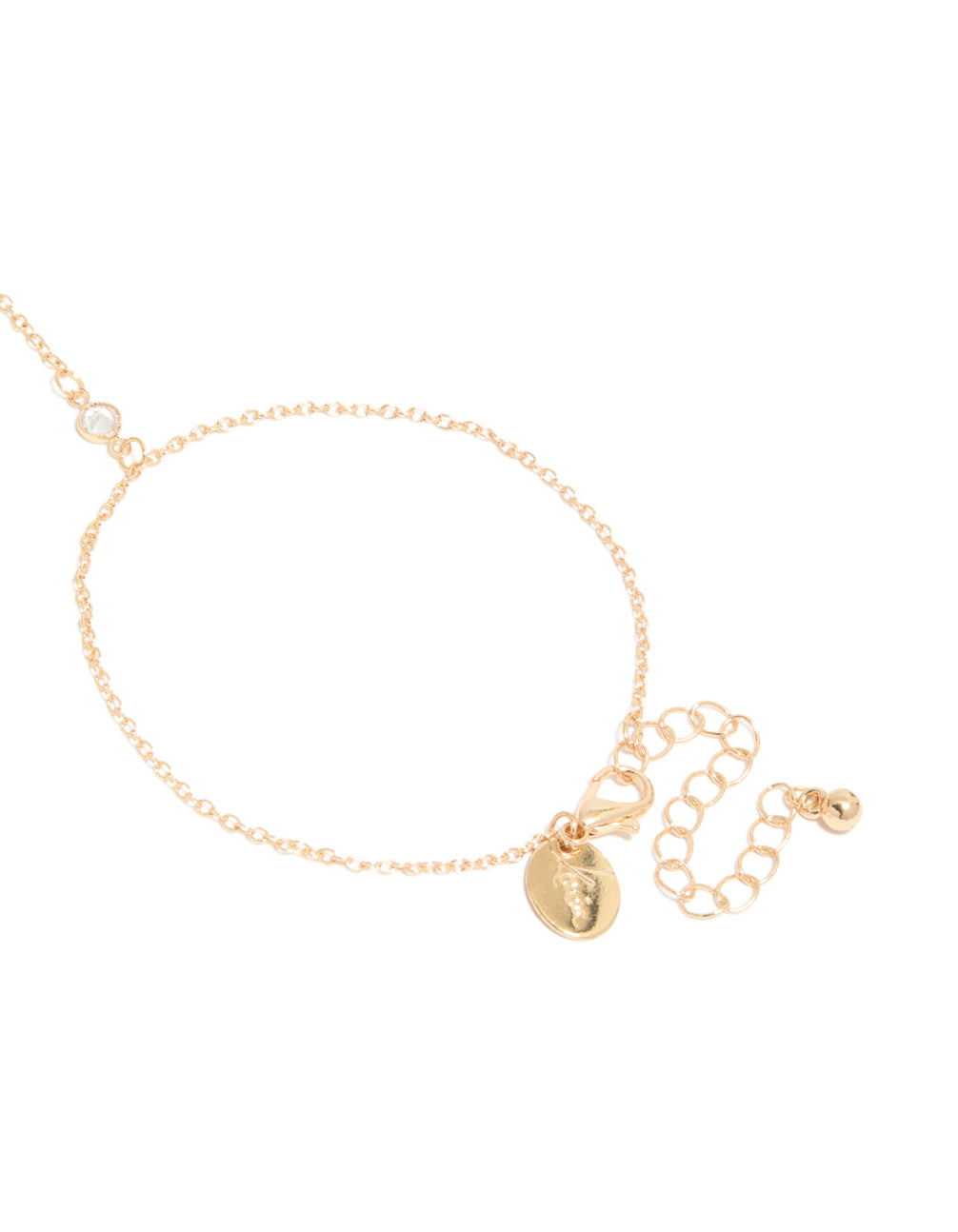 Highlighting a gold hand chain bracelet featuring cross with closure detail view