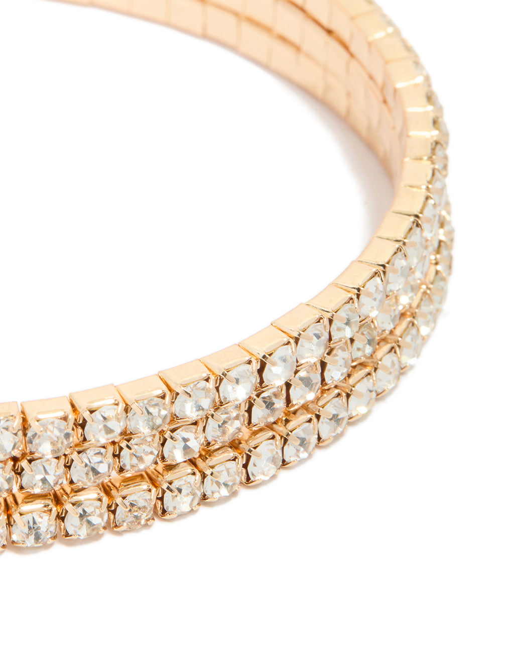 Showcasing gold diamante wrap round arm cuff featuring statement styling in close up view