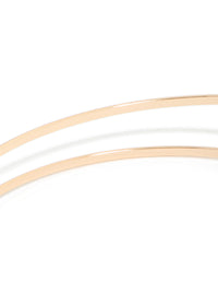 A gold small flower arm cuff with white floral details in close up view - link has visual effect only
