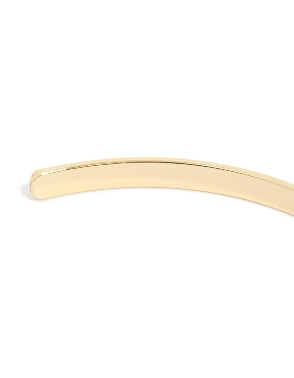 This gold arm cuff features a smooth polished finish with minimalist design in closure detail view