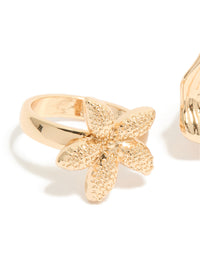 Featuring gold textured starfish and shell rings 3-pack with ocean charm pearl statement styling detail view - link has visual effect only