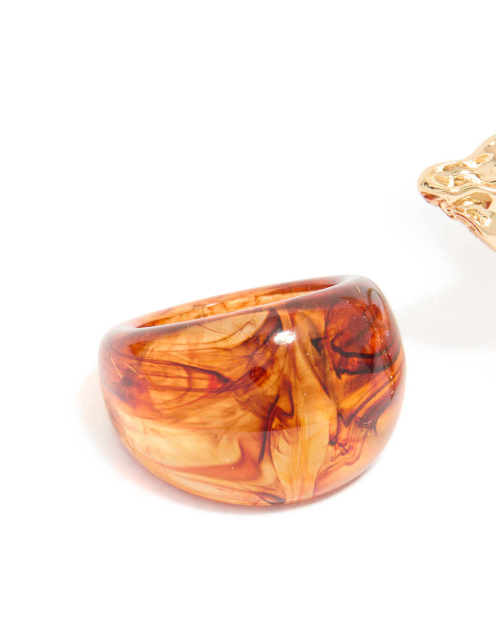 View the 3-pack of acrylic flower rings with coral, orange, and gold statement design detail view