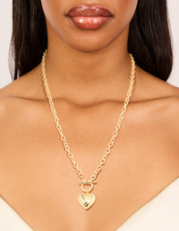 Showcasing a gold plated heart charm necklace on neck view - link has visual effect only
