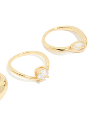 Close view of gold plated cubic zirconia and chunky rings 3-pack with oval cut crystal in statement design close up view - link has visual effect only