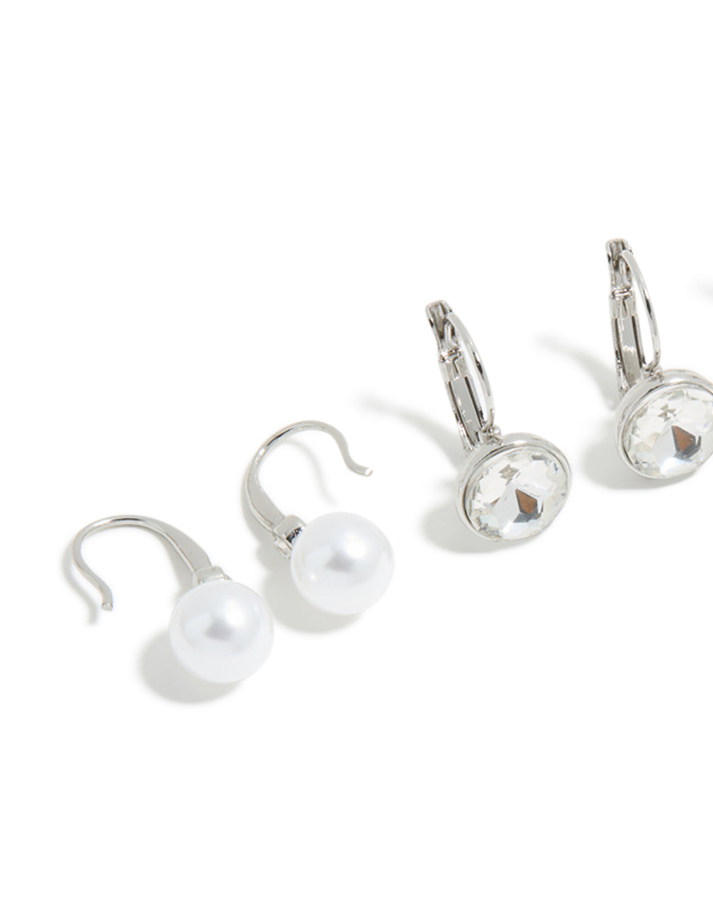 Crafted from silver with diamante and pearl huggie earrings in a 3-pack featuring huggie closure close up view