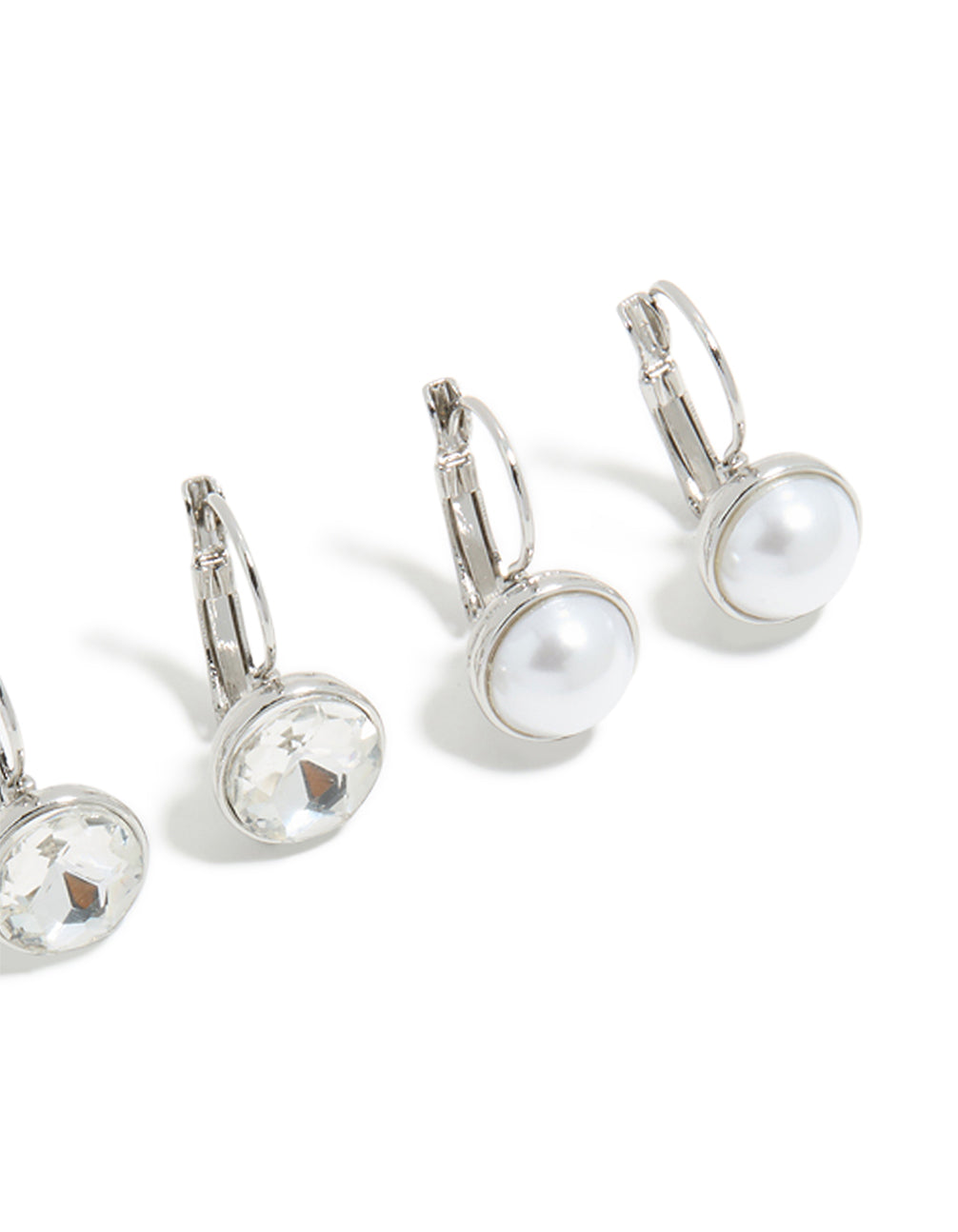 Crafted from silver with diamante and pearl huggie earrings in a 3-pack featuring huggie closure close up view