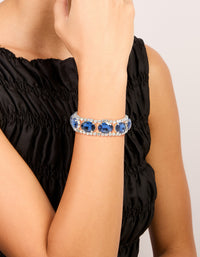 Showcasing a statement bracelet with blue diamantes on wrist view - link has visual effect only