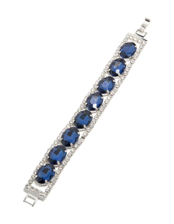 Designed with blue diamantes, this statement bracelet in silver is displayed in front view