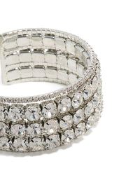 Featuring radiant diamantes, this large statement wrist cuff bangle in silver highlights intricate details in close up view - link has visual effect only