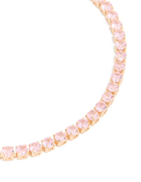 Designed with gold pink cubic zirconia dainty tennis bracelet in light pink close up view - link has visual effect only