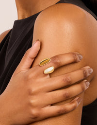 Showcasing a waterproof gold plated stainless steel open double stone ring with brown and ivory stones worn on fingers on finger view - link has visual effect only