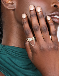 Crafted from silver plated material, this cubic zirconia loop linked stacking ring set with crystal accents on finger view - link has visual effect only