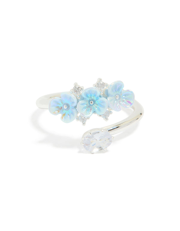 Highlighting the silver plated triple flower wrap ring in powder blue and statement style front view