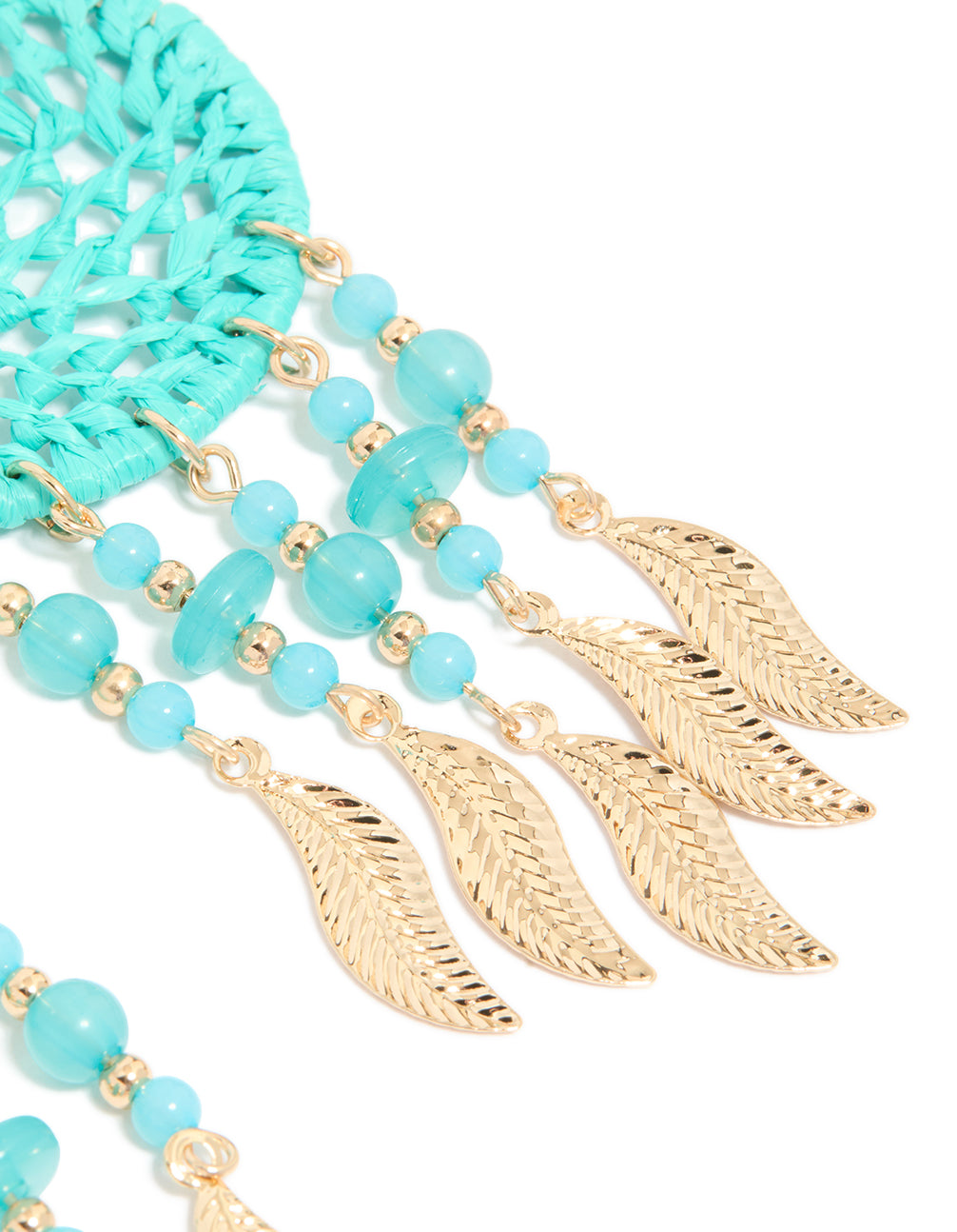 Designed with statement style, these light blue fabric dreamcatcher drop earrings feature charm, beads, feathers in turquoise, aqua, and gold post detail view