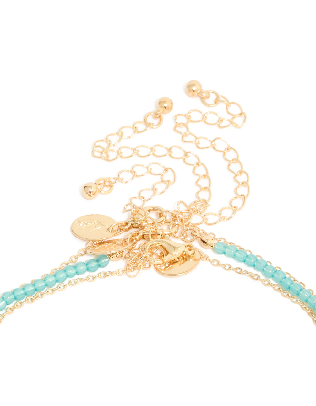 Featuring ocean-inspired shell and starfish, the gold blue beaded layered Y-necklace displays ivory accents clasp detail view