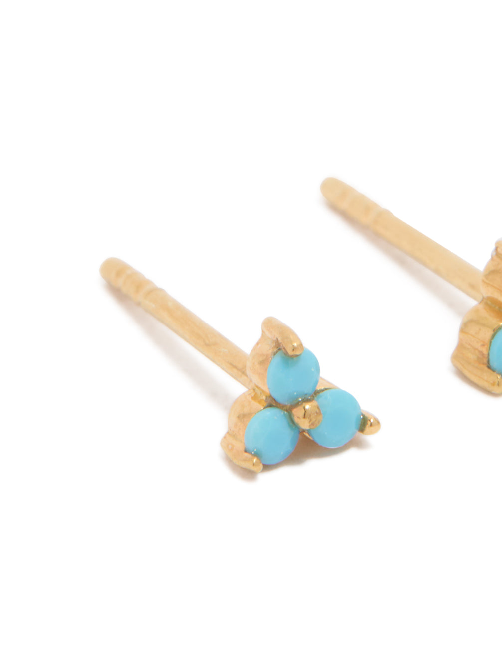 Featuring floral gold plated sterling silver stud earrings with turquoise accents close up view