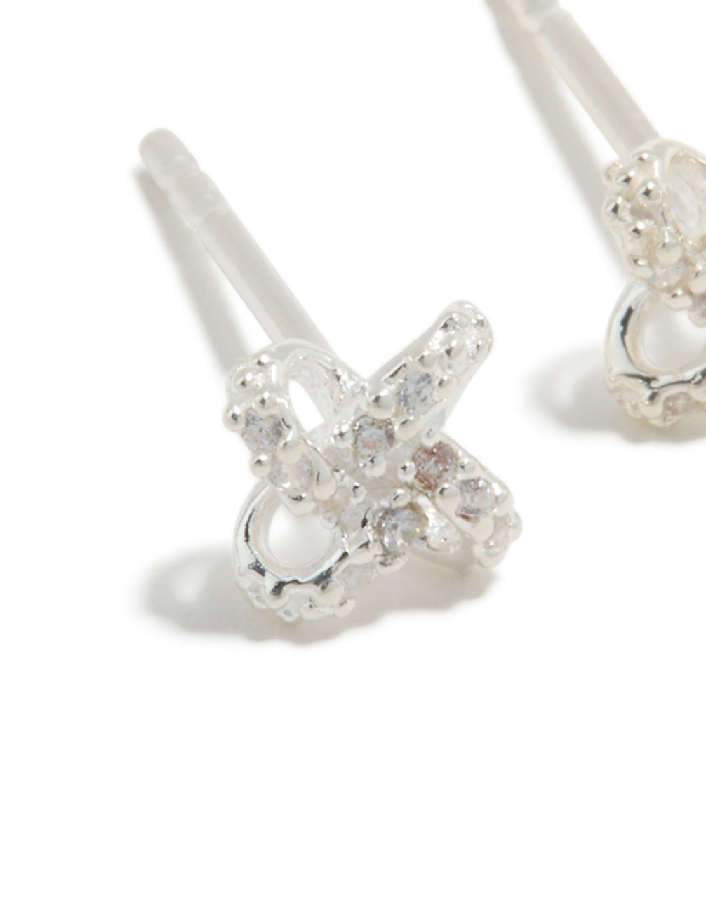 Featuring sterling silver cubic zirconia knot stud earrings with clear accents in a close up view
