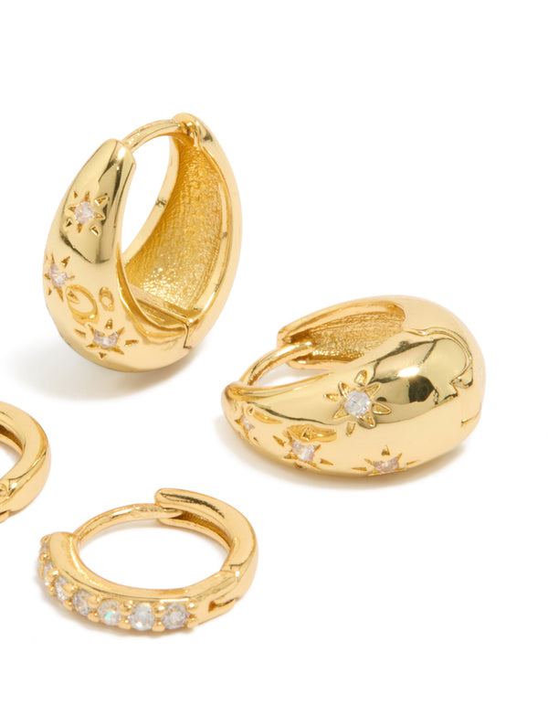 Designed with dainty styling, this 2-pack of gold plated brass huggie earrings features celestial star and teardrop elements adorned with fine cubic zirconia crystals front view
