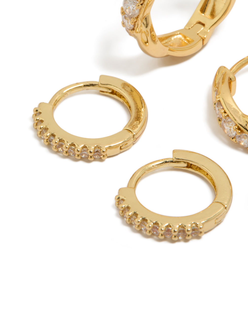 Designed with gold plated brass, these woven and fine cubic zirconia huggie earrings feature crystal accents in a 2-pack close up view