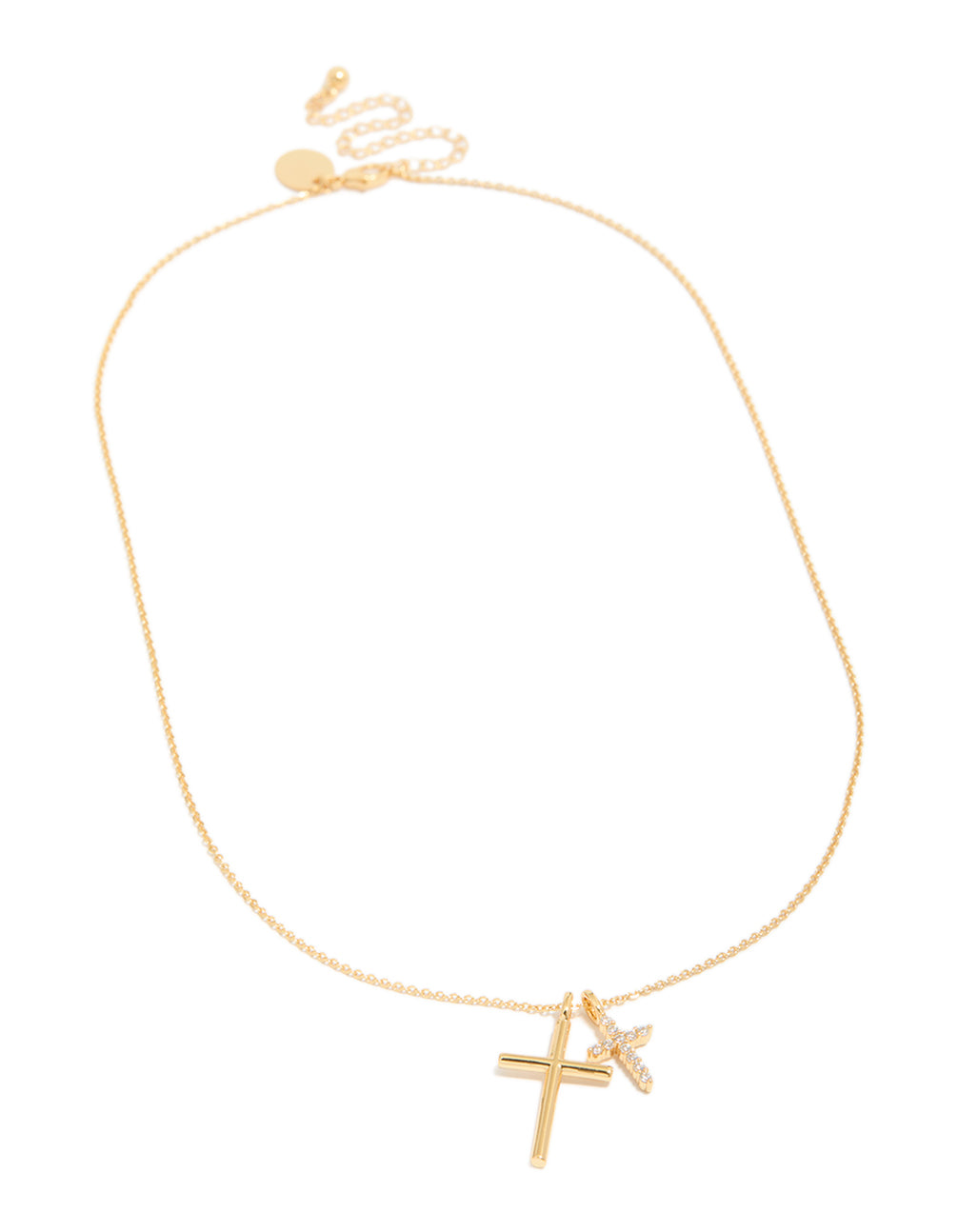 Crafted from brass, this gold plated double cross necklace features charm pendants with cubic zirconia and a dainty style in front view