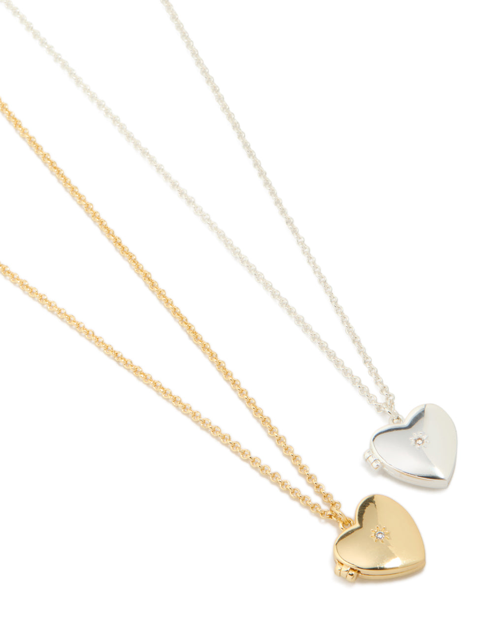 Beautifully crafted heart locket necklaces featuring cubic zirconia with silver and gold plated brass in a 2-pack close up view