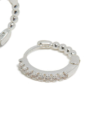 Skinny huggie earrings crafted from silver plated material with cubic zirconia and hoop closure post detail view - link has visual effect only