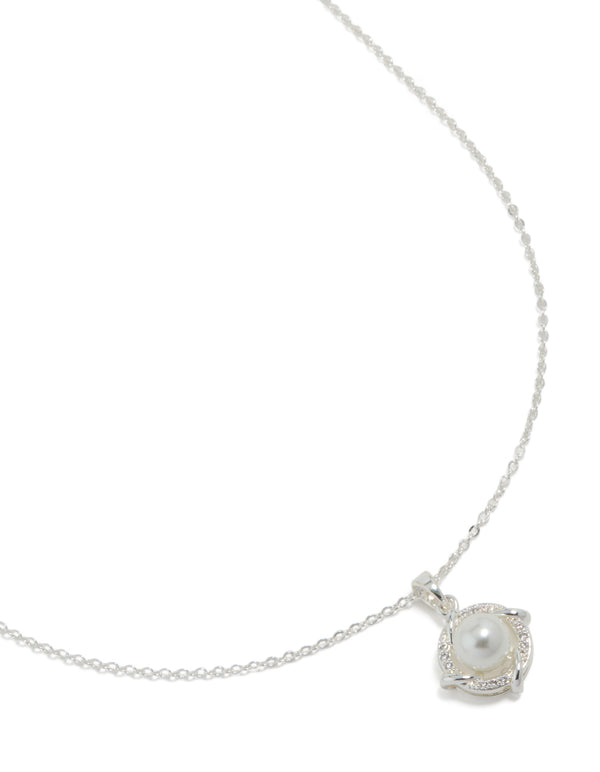 Showcasing a silver plated cubic zirconia pearl centre pendant necklace close up view