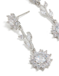 Highlighting silver cubic zirconia vine floral drop earrings with leaf design close up view - link has visual effect only