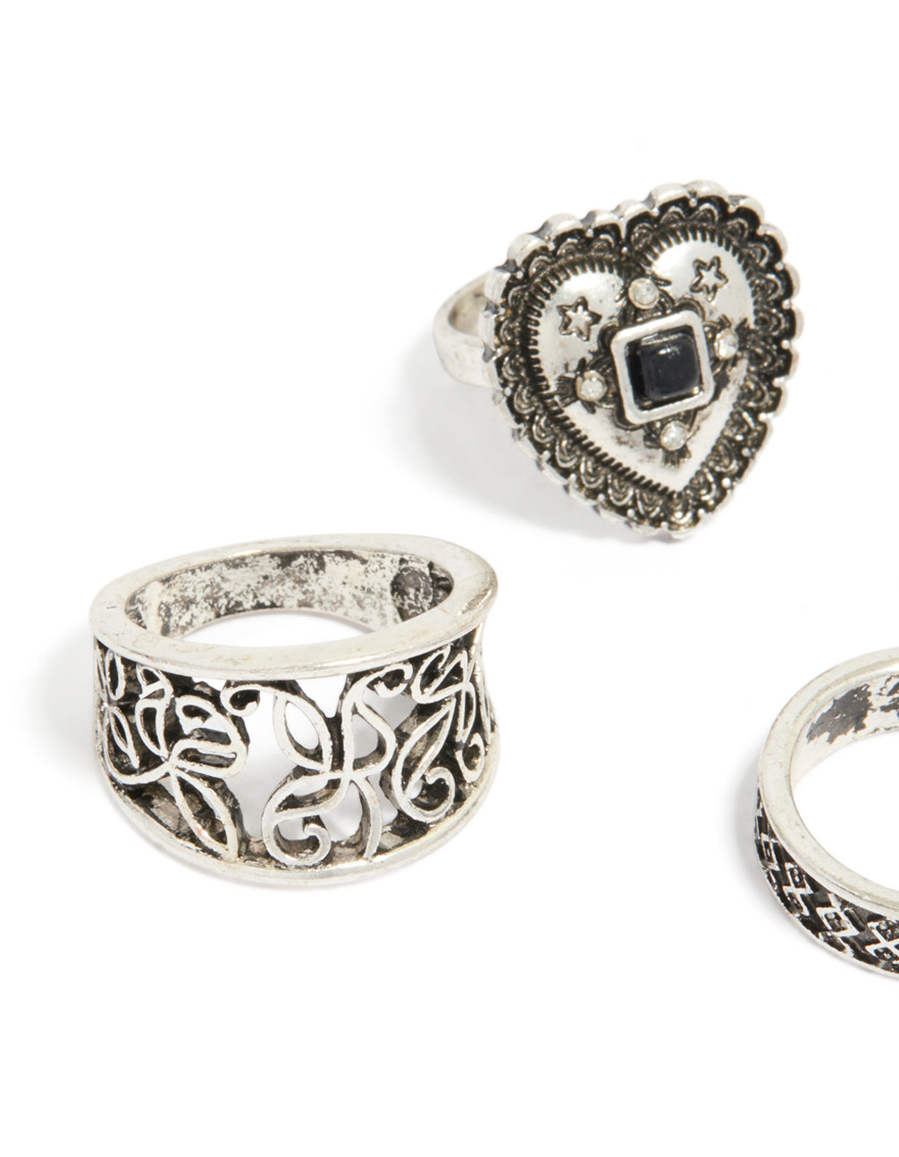 Showcasing antique silver heart and textured rings 4-pack with floral details close up view