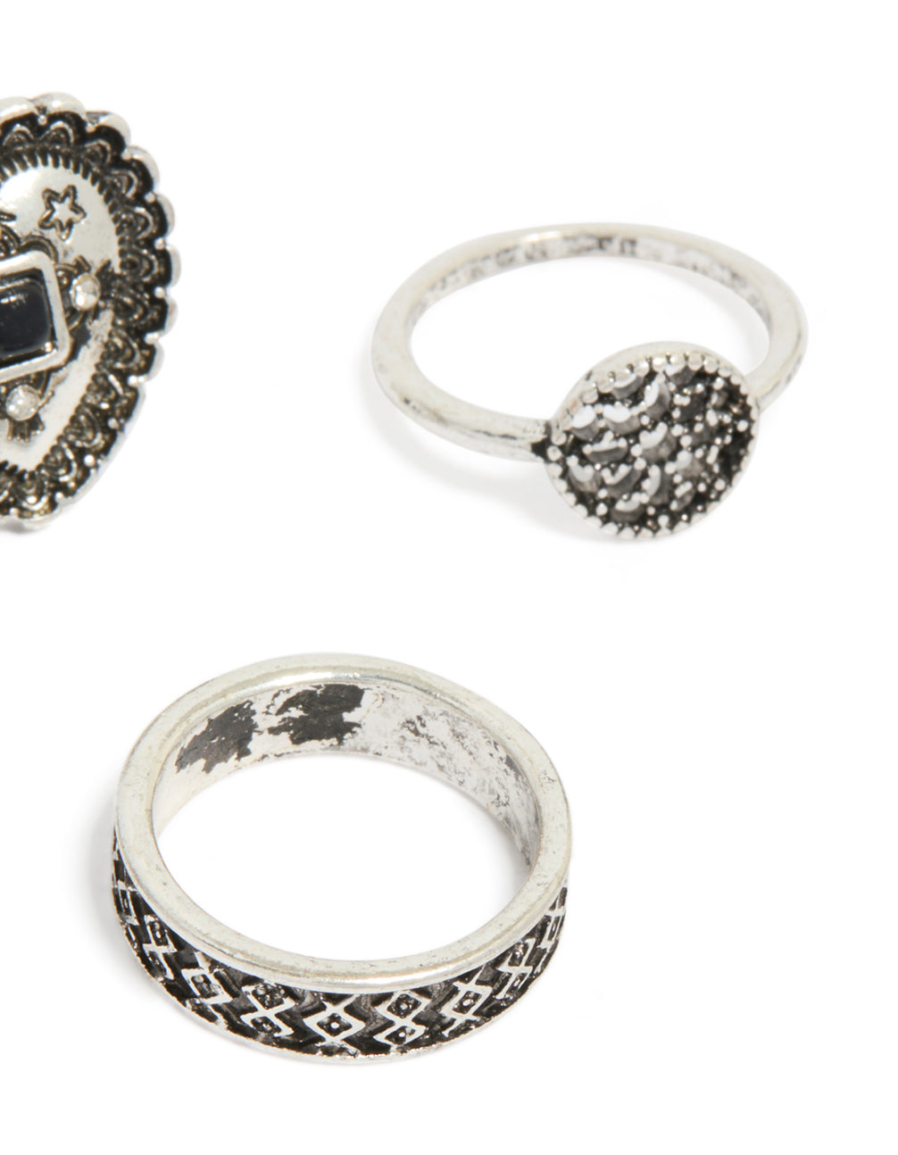 Crafted from antique silver, heart and textured rings 4-pack featuring floral design side detail view