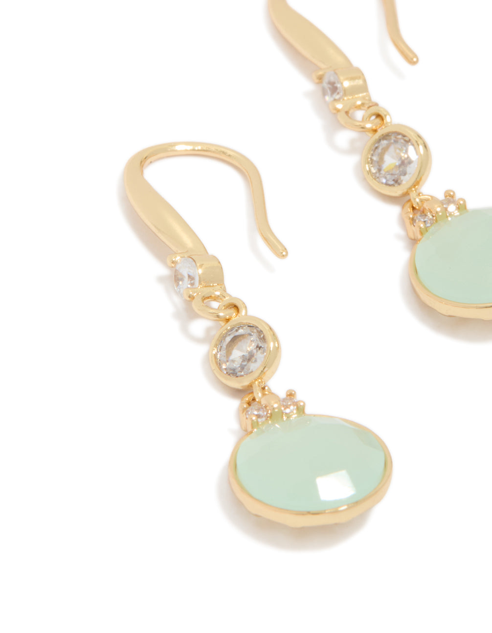 Featuring dainty gold plated blue cubic zirconia circle drop earrings with pale turquoise stones close up view