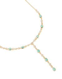 Showcasing a charm Y-necklace crafted from gold plated materials with blue cubic zirconia stones close up view - link has visual effect only