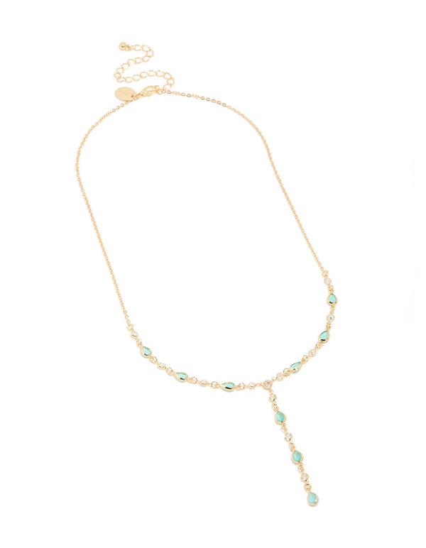 Featuring a charm Y-necklace with gold plated finish and blue cubic zirconia stones front view