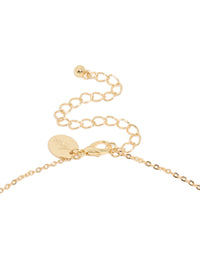Highlighting a charm Y-necklace in gold plated material blue cubic zirconia stones clasp detail view - link has visual effect only