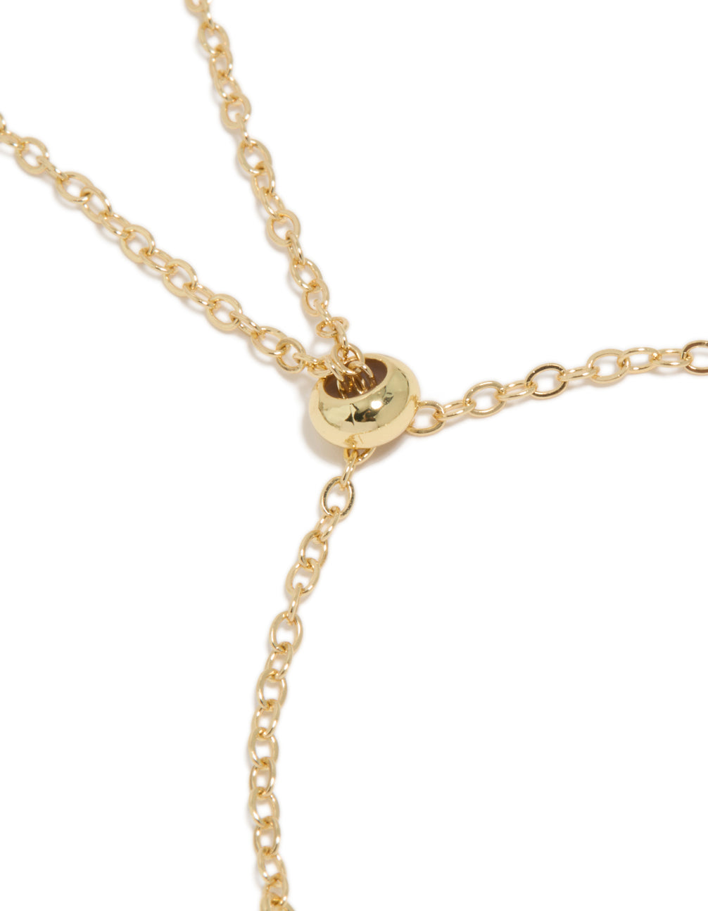 Designed bracelet featuring gold plated metal and deep blue cubic zirconia stones in a statement design closure detail view