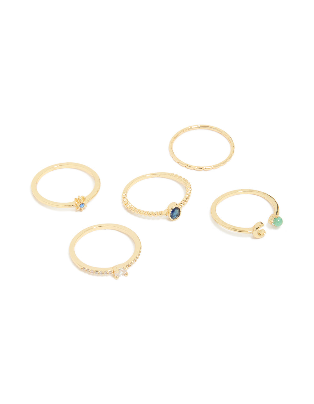 Five delicate gold plated celestial rings featuring moon, star, and cubic zirconia in blue and aquamarine front view