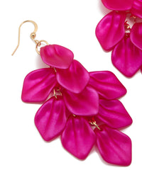 Featuring fuchsia pink coated metal petal drop statement earrings with gold hardware close up view - link has visual effect only