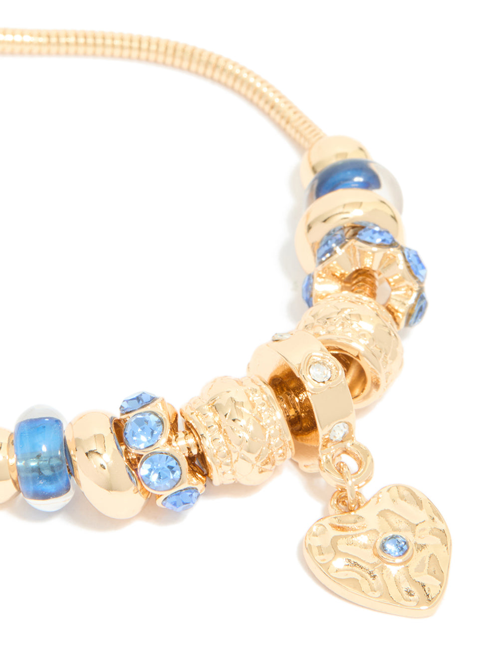 Highlighting a gold blue diamante and molten heart charm toggle bracelet with beaded and balls texture close up view