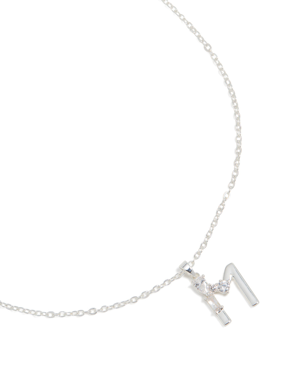 Showcasing a thin cubic zirconia letter M necklace with an initial pendant, crafted from silver plated, close up view