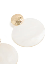 Presenting statement drop earrings crafted from hammered gold and white genuine shell post detail view - link has visual effect only